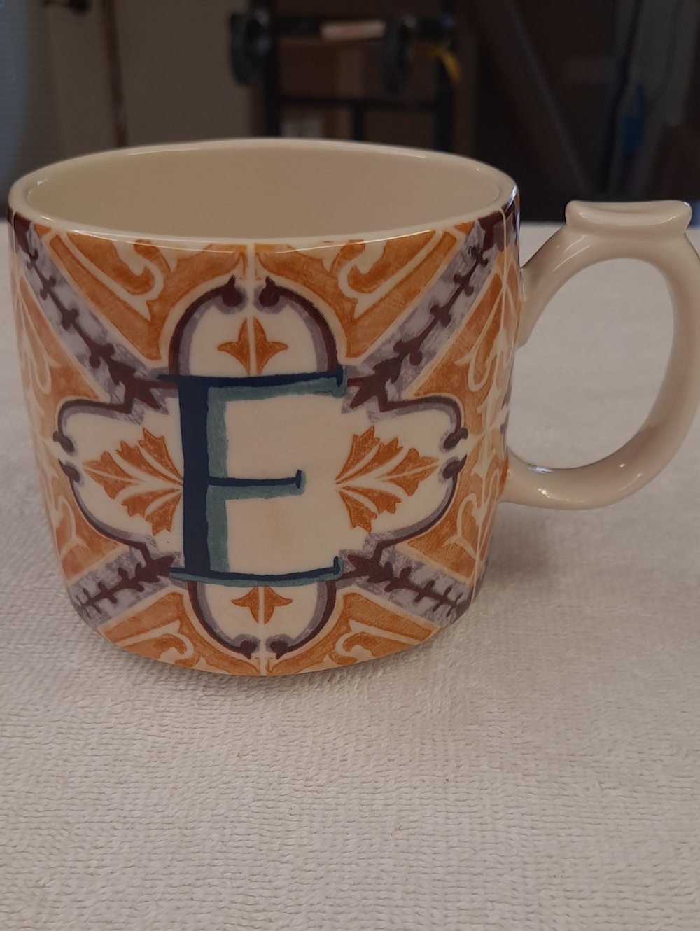Anthropologie Cream Stoneware Mug with E monogram.